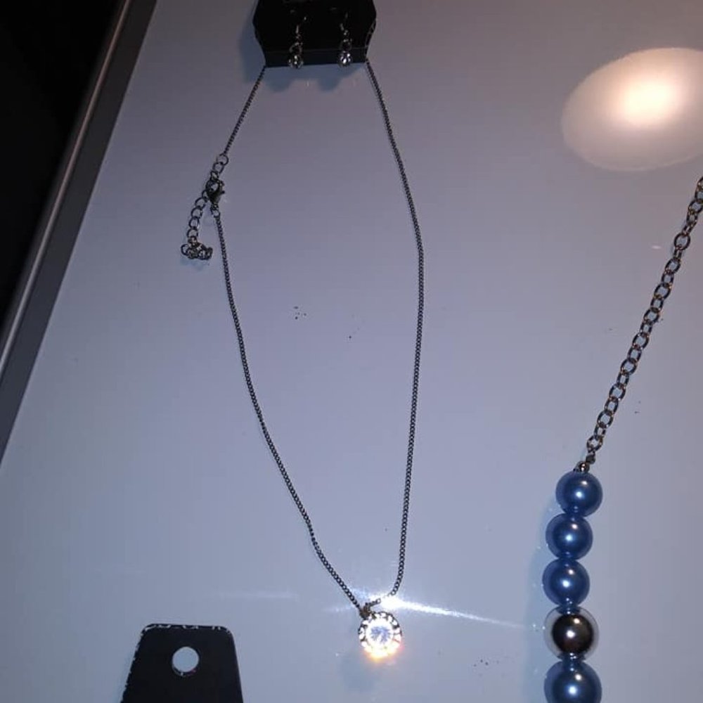 White necklace with matching earrings